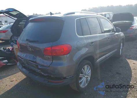 2014 Volkswagen Tiguan Sel z USA, uszkodzony, nr VIN WVGAV3AXXEW556304